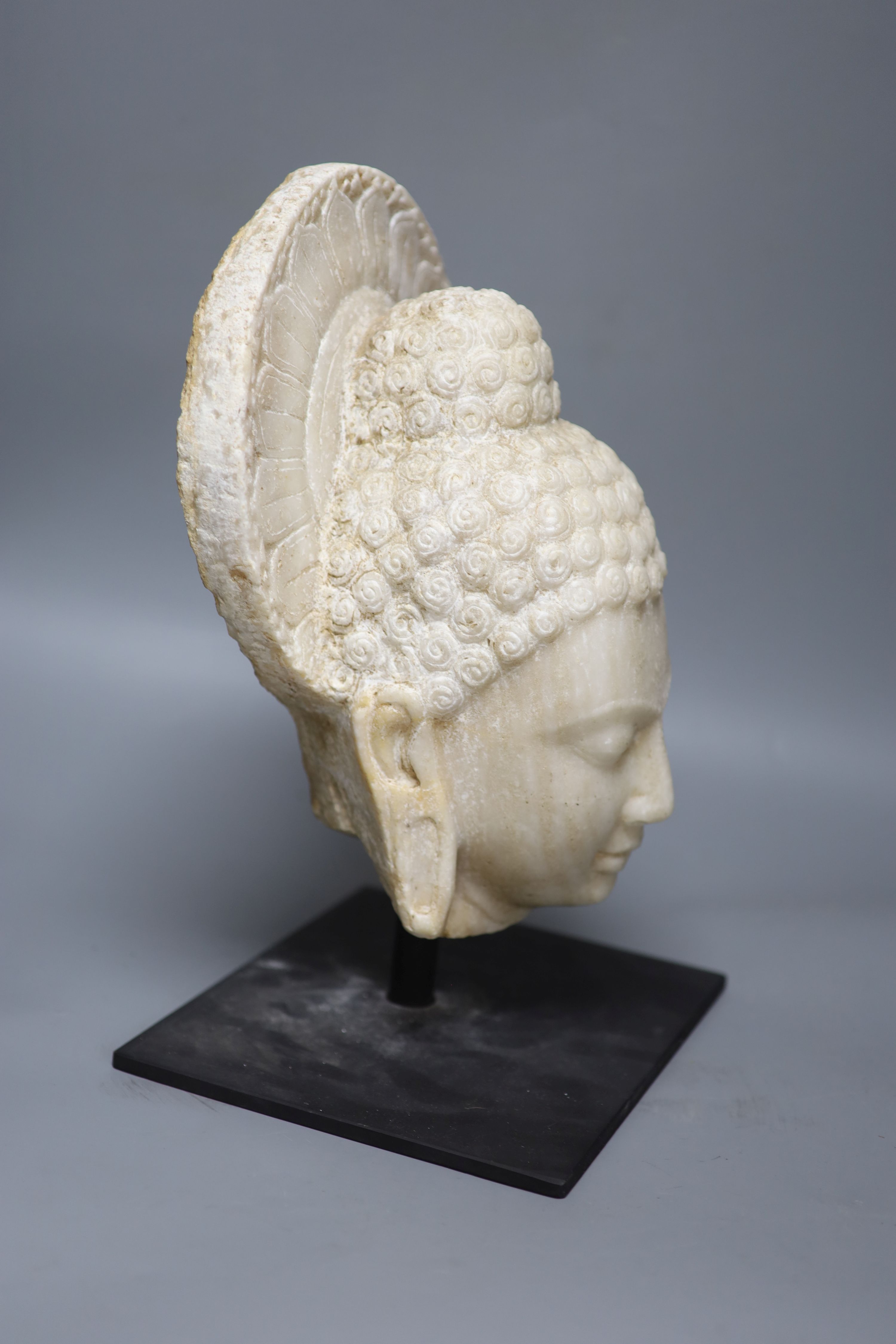 A Gandharan style alabaster head, height 37cm